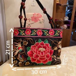 This very special and beautiful embroidery Handbag
